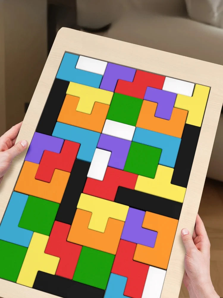 Child playing with educational wooden puzzle pieces developing problem-solving skills